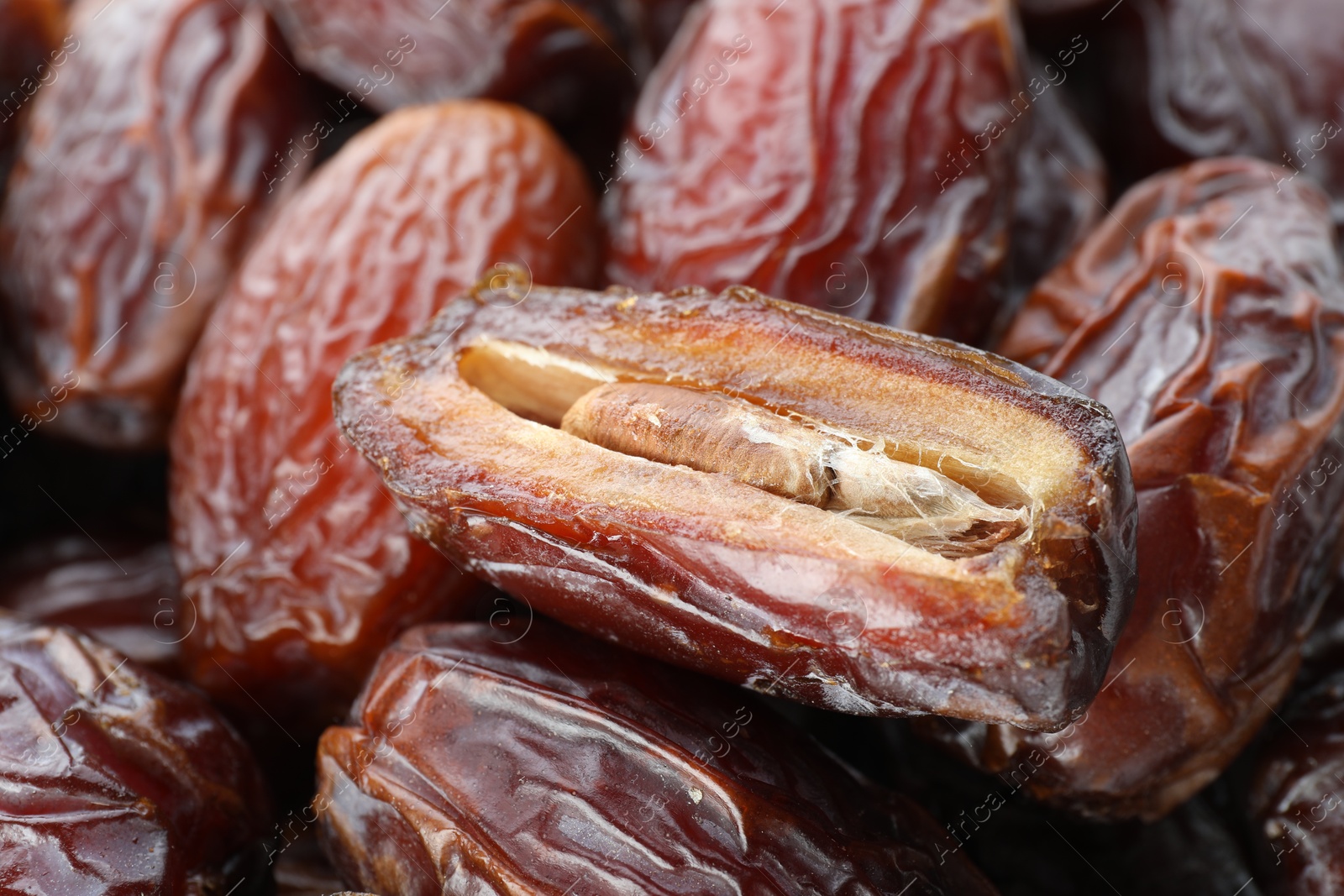 Photo of Many tasty dried dates as background, closeup