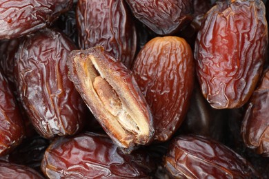 Photo of Many tasty dried dates as background, closeup