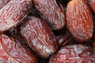 Photo of Many tasty dried dates as background, closeup