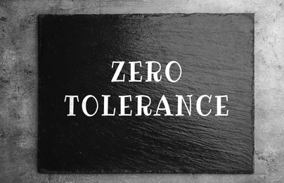 Image of Zero Tolerance concept. Sign with words on wooden background