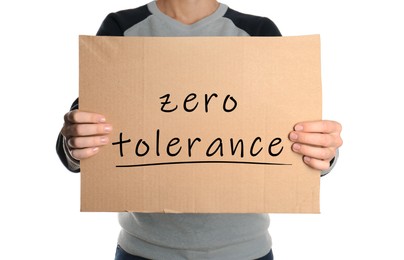 Image of Woman holding piece of cardboard with words Zero Tolerance on white background, closeup