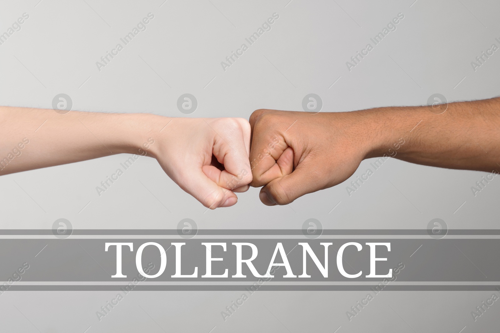 Image of Tolerance concept. People making fist bump on grey background, closeup