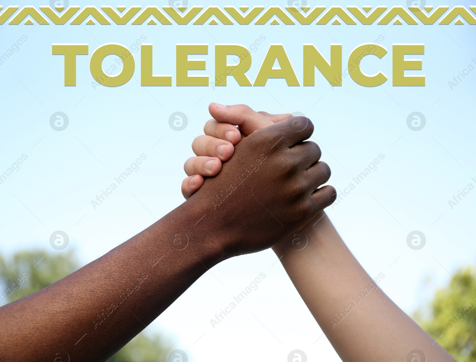 Image of Tolerance concept. Men clasping hands outdoors, closeup