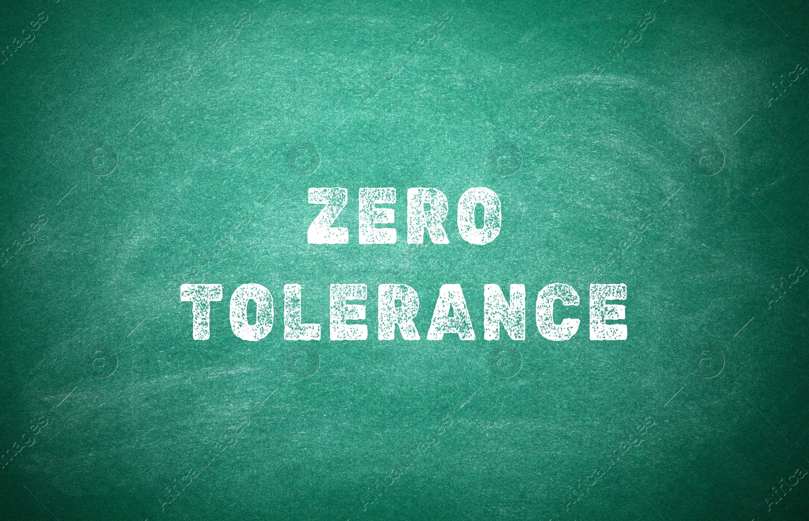 Image of Zero Tolerance concept. Words on green chalkboard