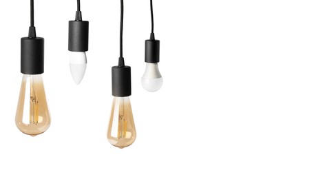 Image of Different light bulbs hanging on white background. Banner design with space for text