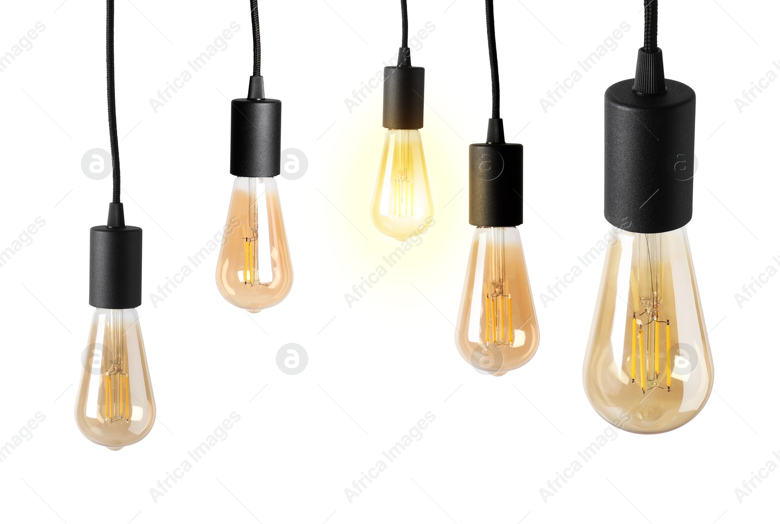 Image of One glowing light bulb among others on white background