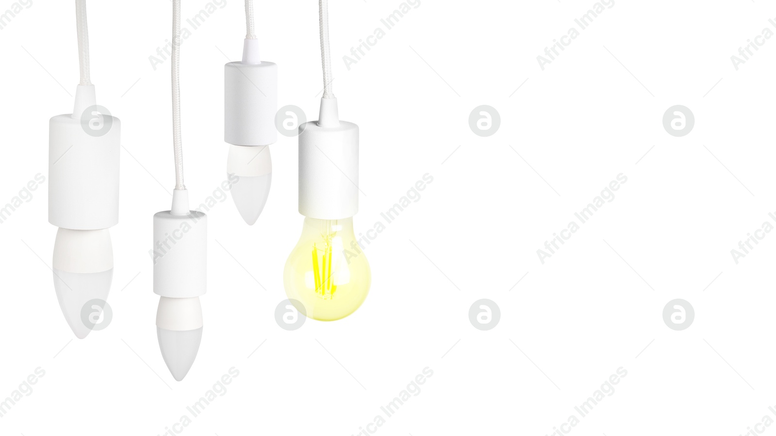 Image of One glowing light bulb among others on white background. Banner design with space for text