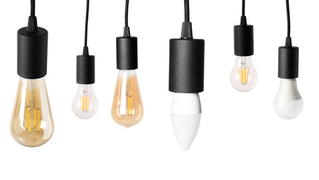 Image of Different light bulbs hanging on white background. Banner design