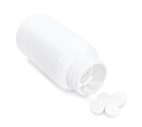 Photo of Antibiotic pills with medical bottle on white background