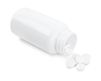 Photo of Antibiotic pills with medical bottle on white background