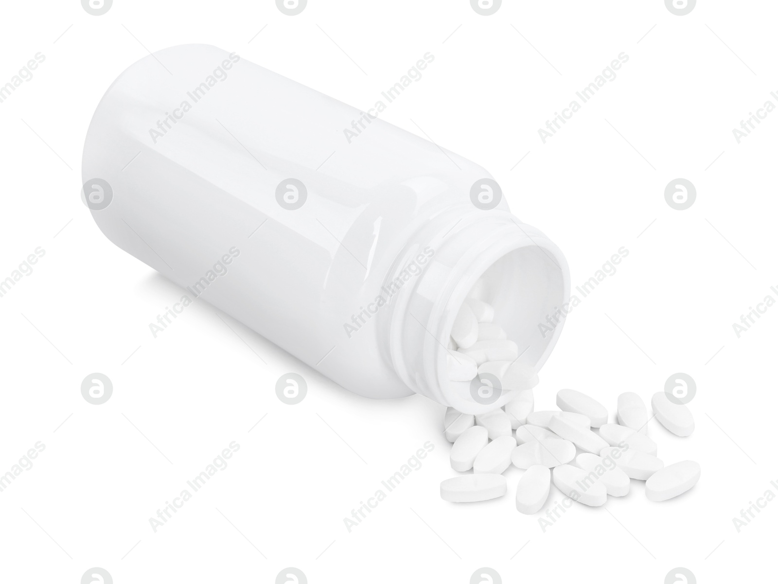 Photo of Antibiotic pills with medical bottle on white background