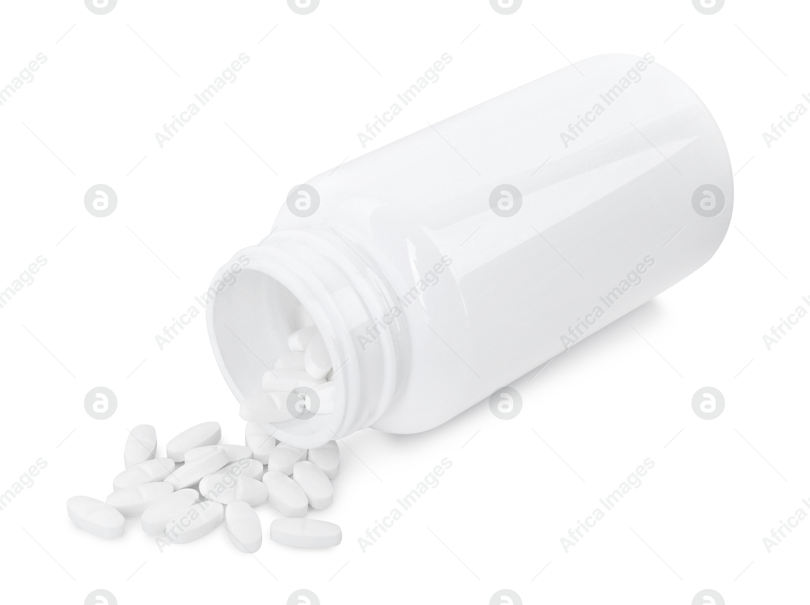 Photo of Antibiotic pills with medical bottle on white background