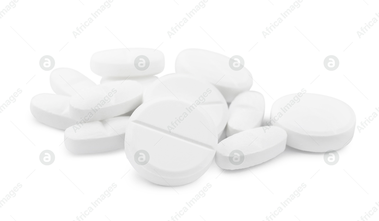 Photo of Pile of antibiotic pills on light grey background, closeup