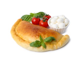 Photo of Tasty vegetarian calzone with basil, mozzarella cheese and tomatoes isolated on white