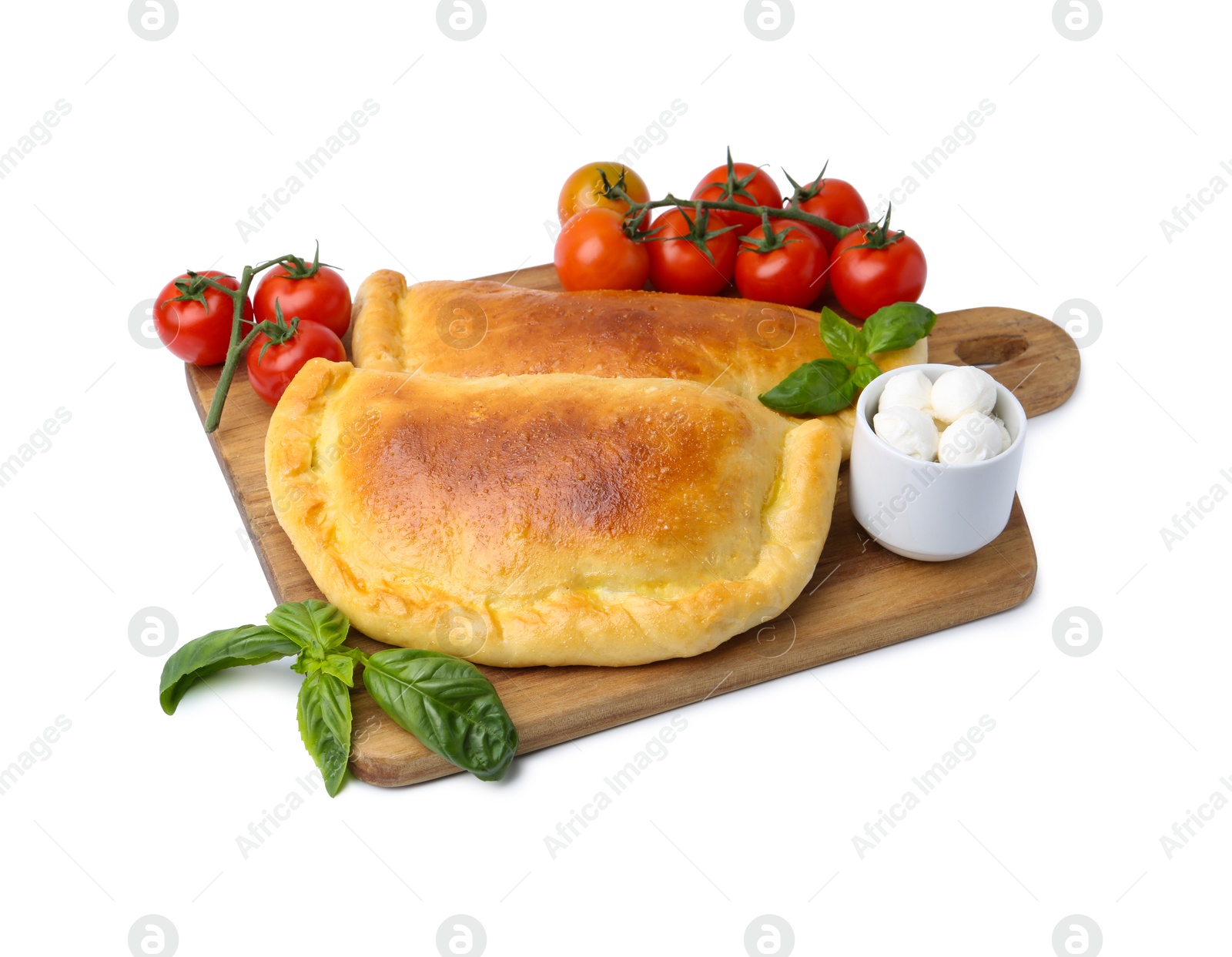 Photo of Tasty vegetarian calzones with basil, mozzarella cheese and tomatoes isolated on white