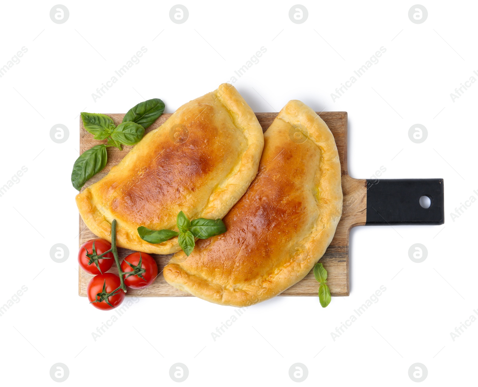 Photo of Tasty vegetarian calzones with basil and tomatoes isolated on white, top view