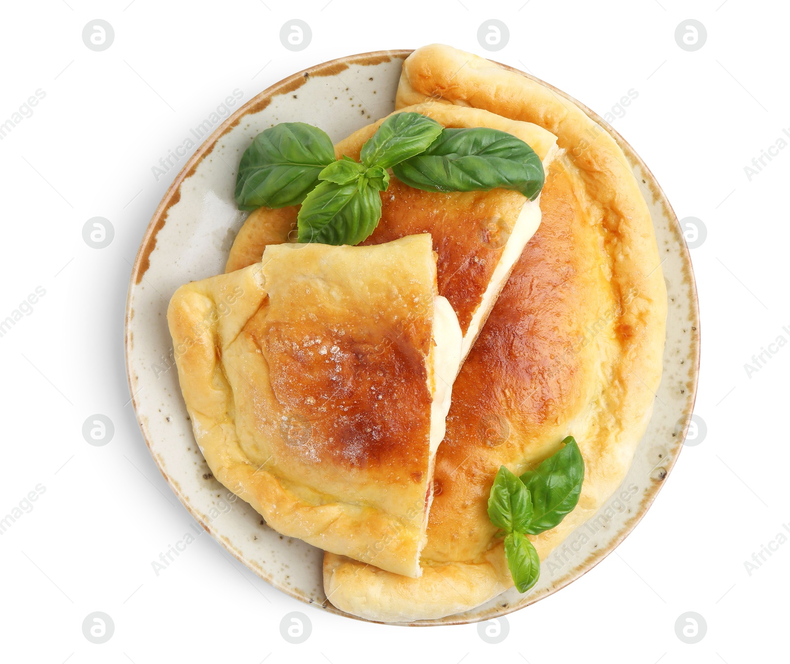 Photo of Pieces of delicious calzone pizza with mozzarella, tomatoes and basil isolated on white, top view