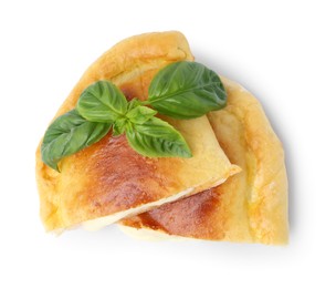 Photo of Pieces of delicious calzone pizza with mozzarella, tomatoes and basil isolated on white, top view