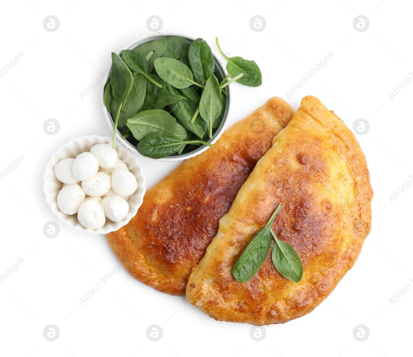 Photo of Tasty calzones with basil and mozzarella cheese isolated on white, top view