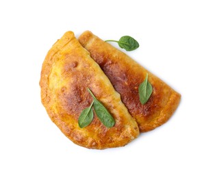 Photo of Tasty calzones with basil isolated on white, top view