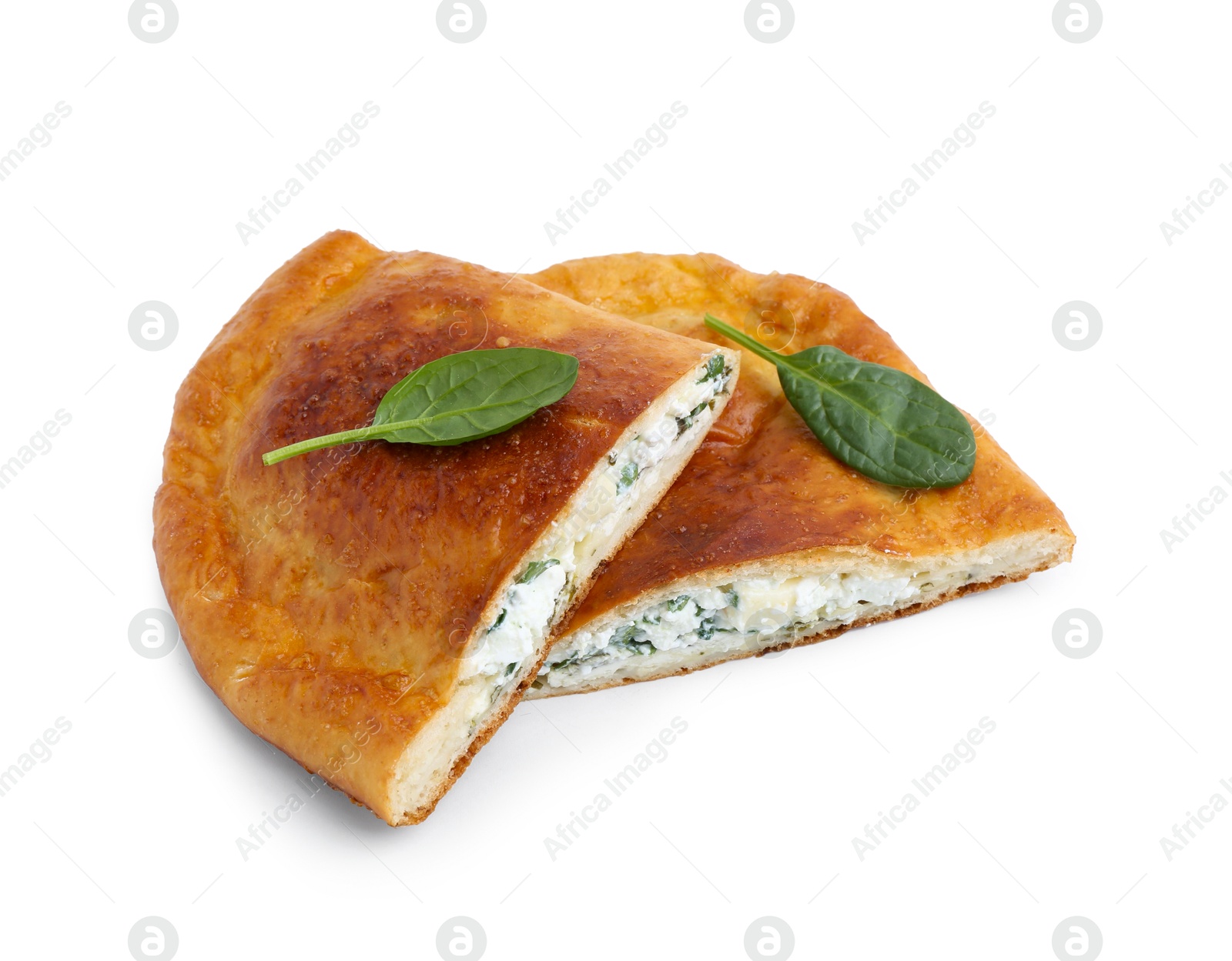 Photo of Pieces of tasty calzone with cheese and basil isolated on white