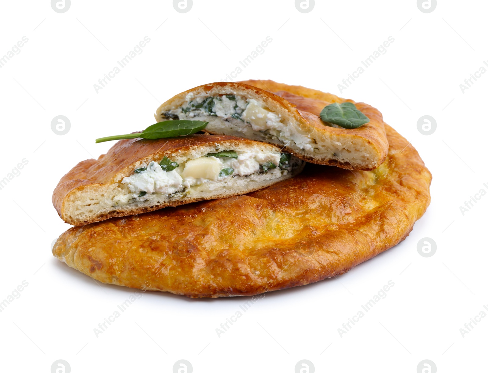 Photo of Tasty calzones with cheese and basil isolated on white