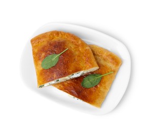 Photo of Pieces of tasty calzone with cheese and basil isolated on white, top view