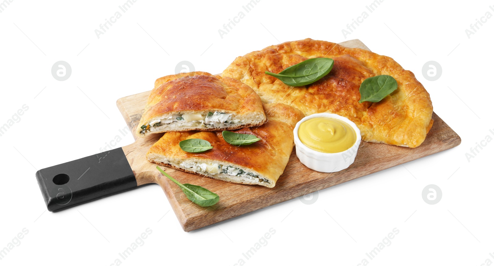 Photo of Tasty calzones with basil, cheese and sauce isolated on white