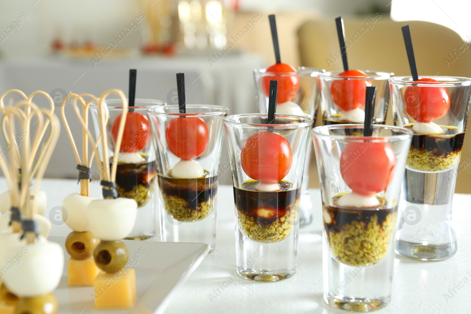 Photo of Many different tasty canapes on white table, closeup