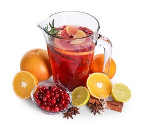 Photo of Aromatic punch drink in glass jug and ingredients on white background