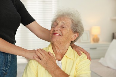 Photo of Senior woman with her granddaughter at home