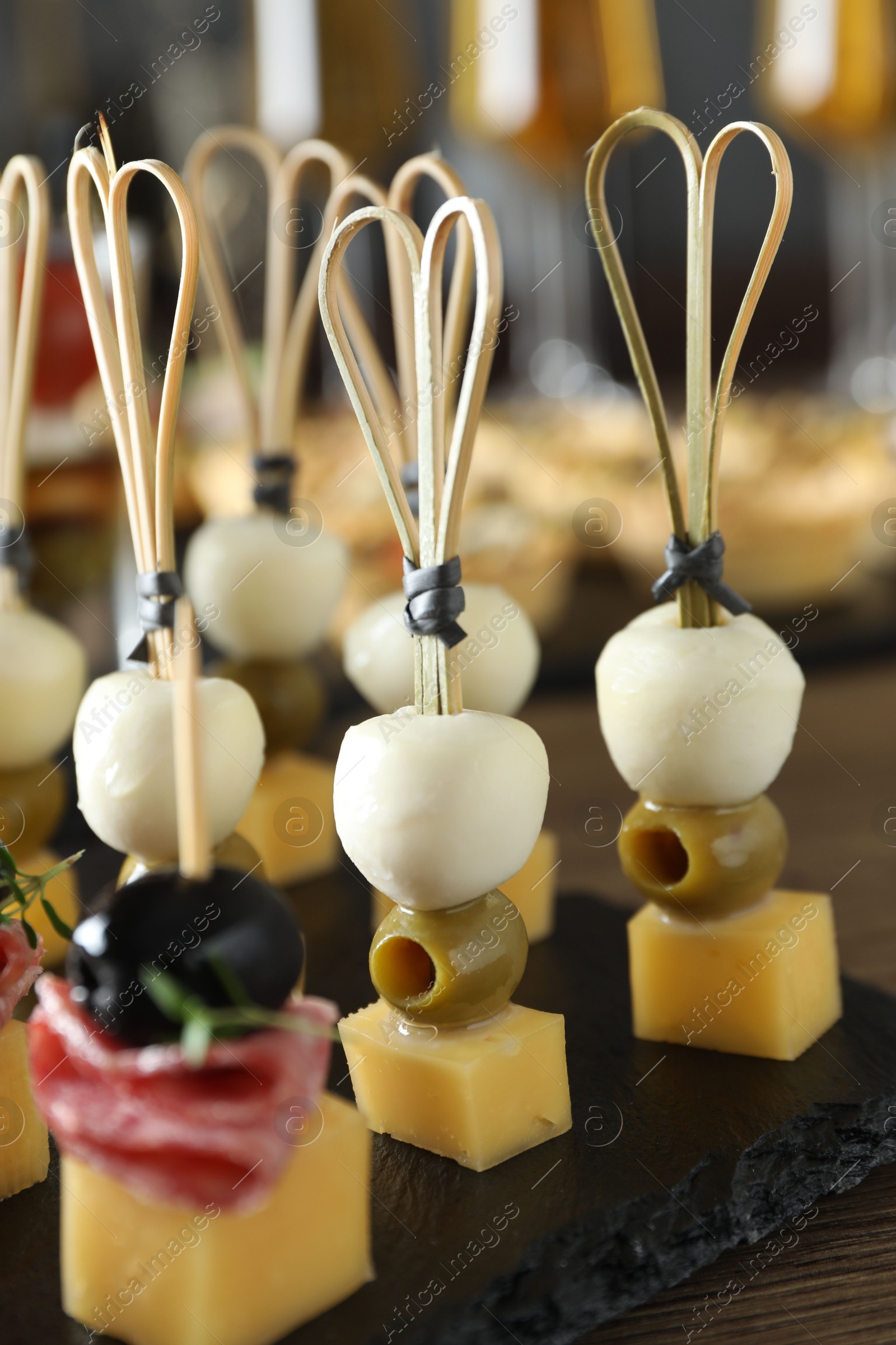 Photo of Many different tasty canapes on table, closeup