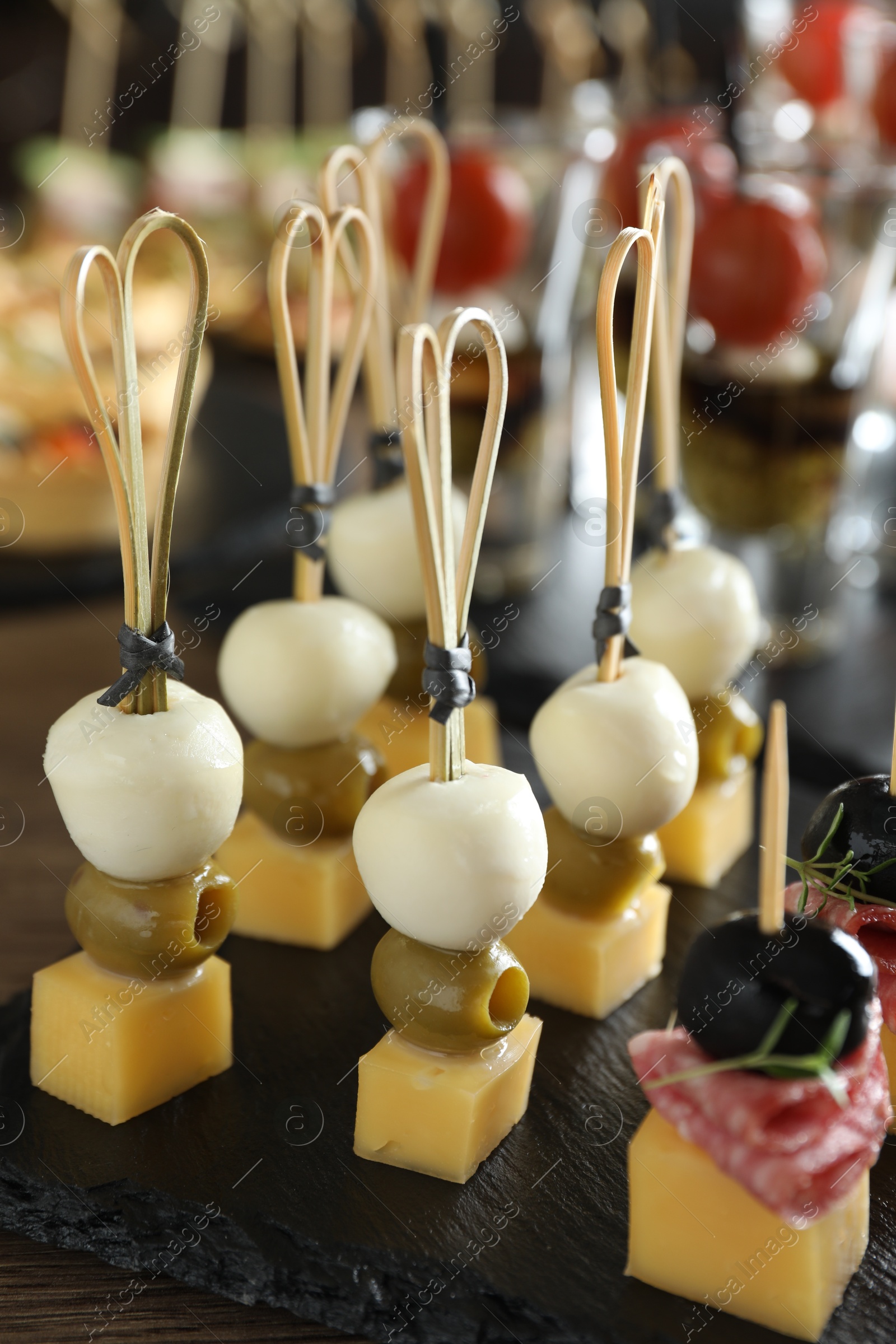 Photo of Many different tasty canapes on table, closeup