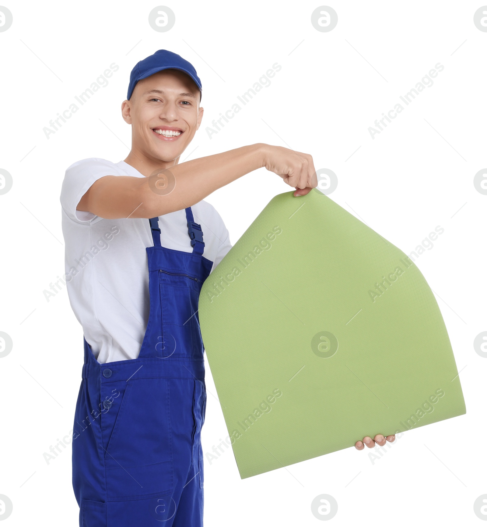 Photo of Young decorator with roll of wallpaper on white background