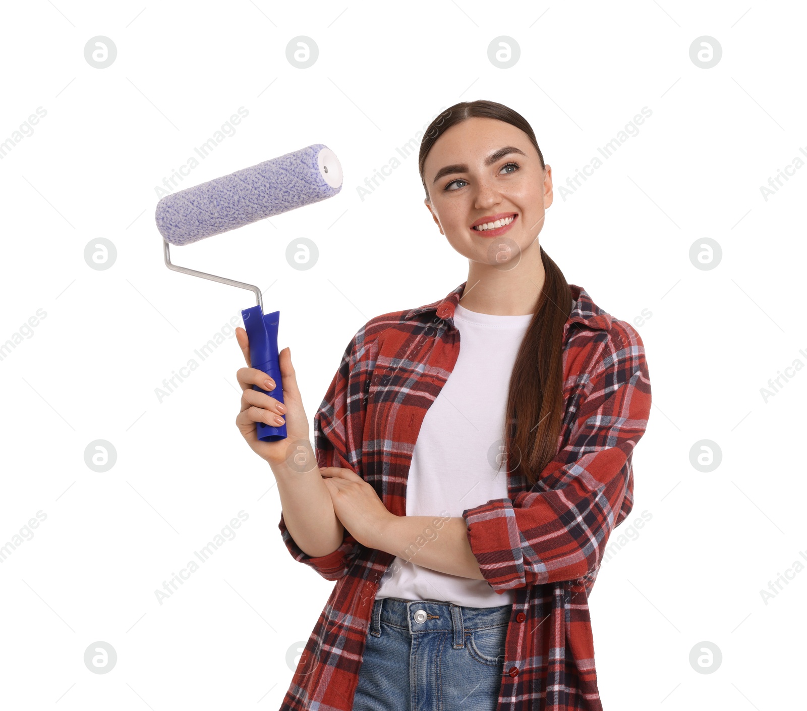 Photo of Portrait of young decorator with paint roller on white background