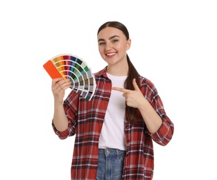 Photo of Portrait of young decorator with color palettes on white background