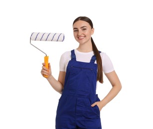 Photo of Portrait of young decorator with paint roller on white background