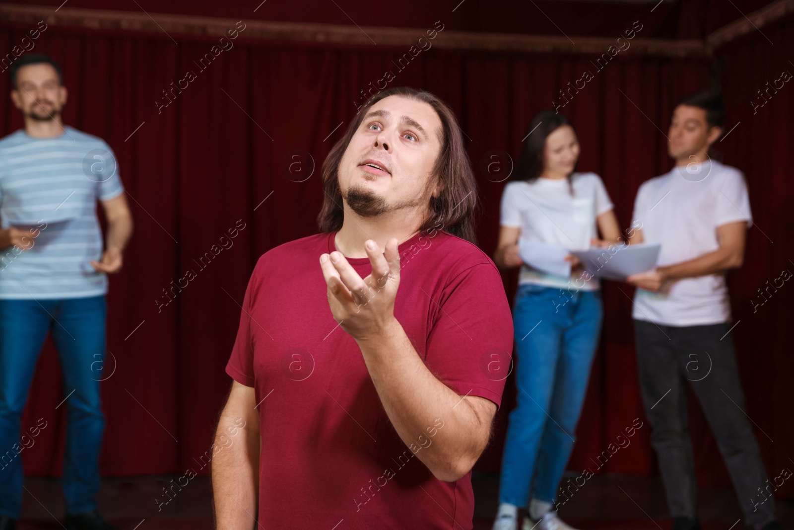 Photo of Professional actor rehearsing on stage in theatre