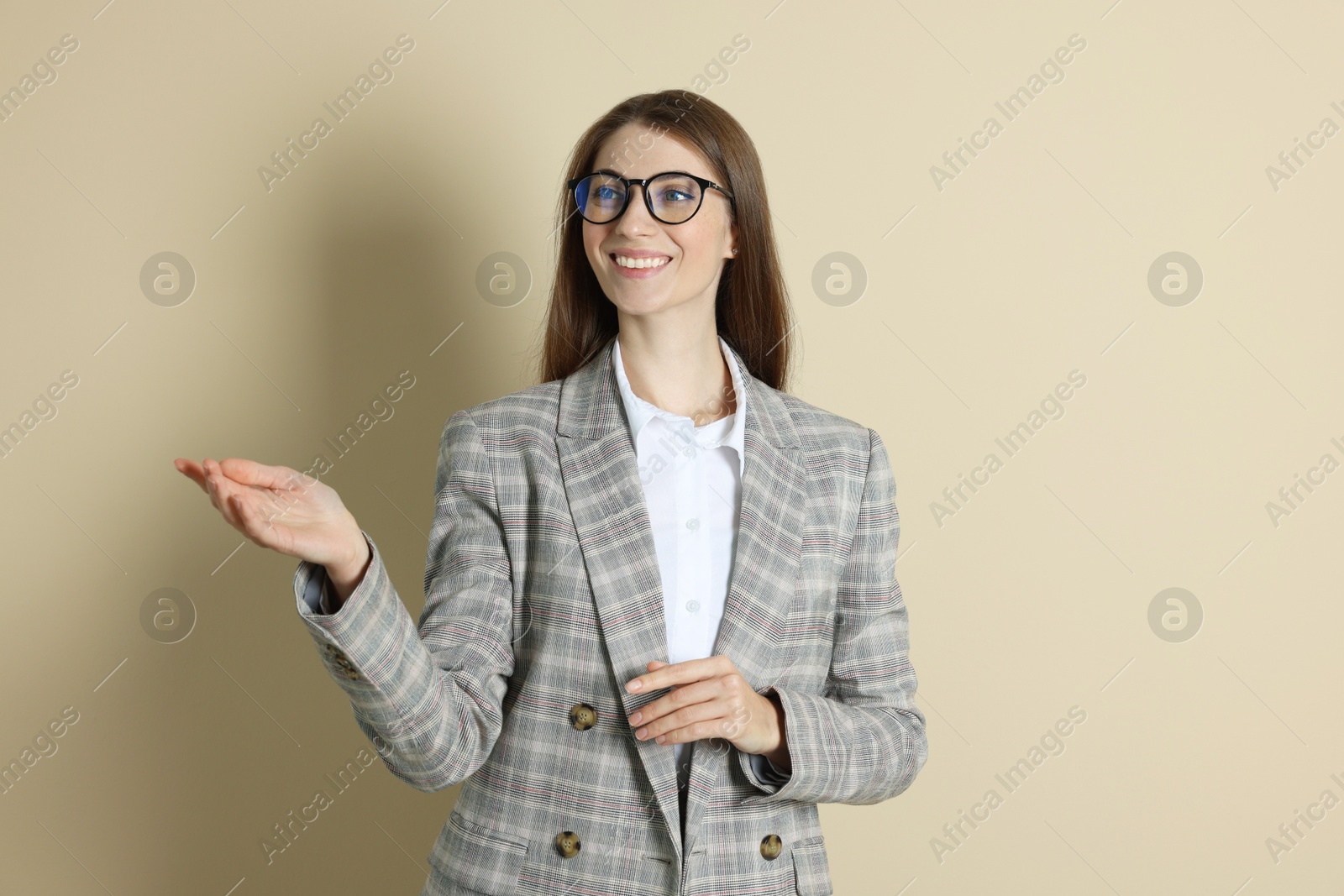 Photo of Portrait of smiling banker on beige background