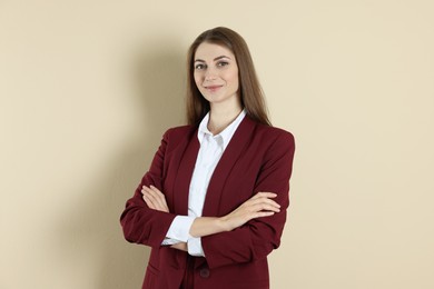 Photo of Portrait of smiling banker on beige background