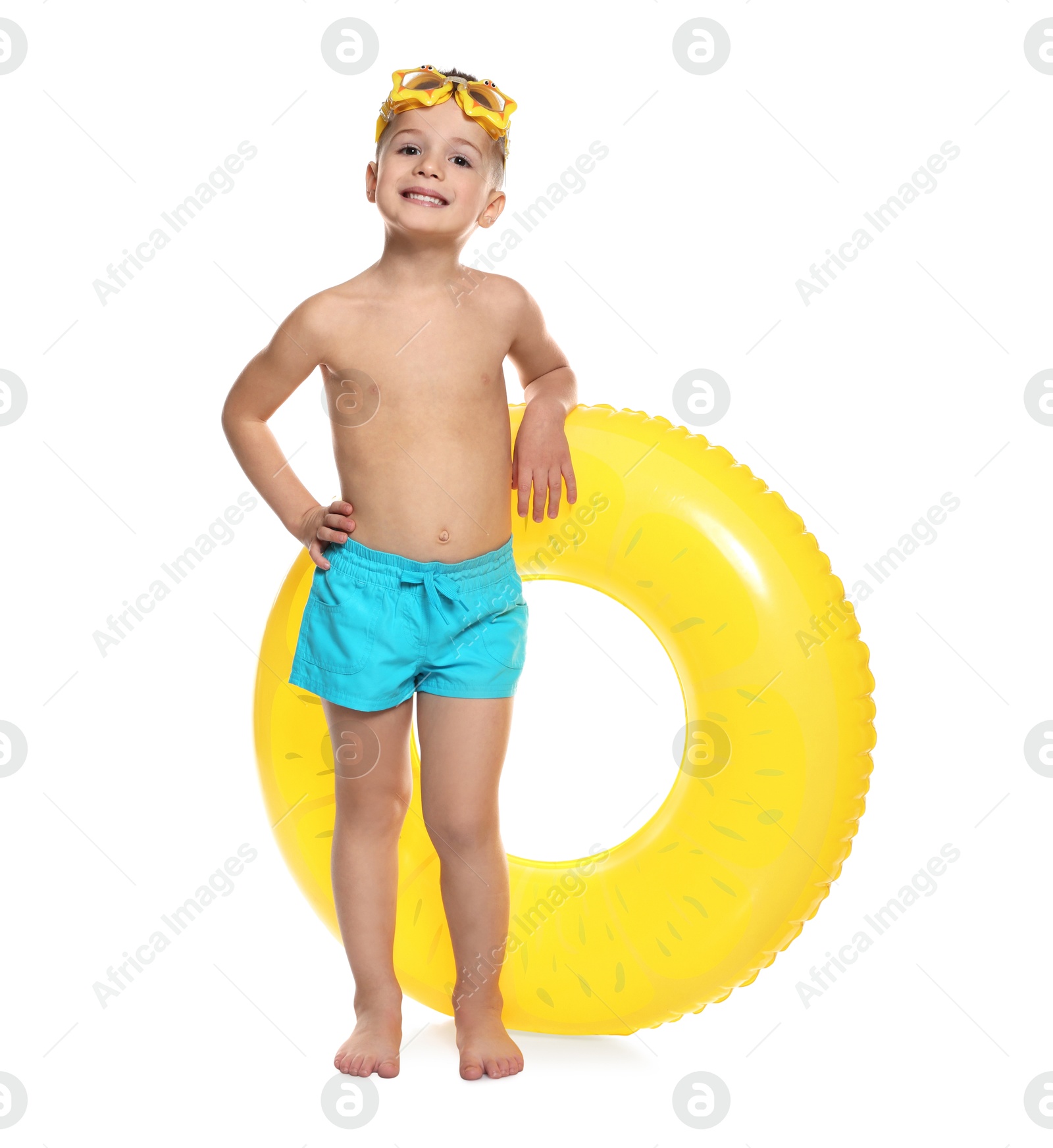 Photo of Cute little boy in beachwear with diving mask and inflatable ring on white background