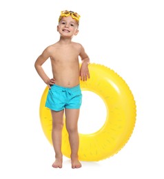 Photo of Cute little boy in beachwear with diving mask and inflatable ring on white background