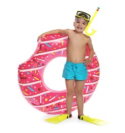 Photo of Cute little boy in beachwear with snorkeling equipment and inflatable ring on white background