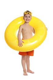 Photo of Cute little boy in beachwear with diving mask and inflatable ring on white background