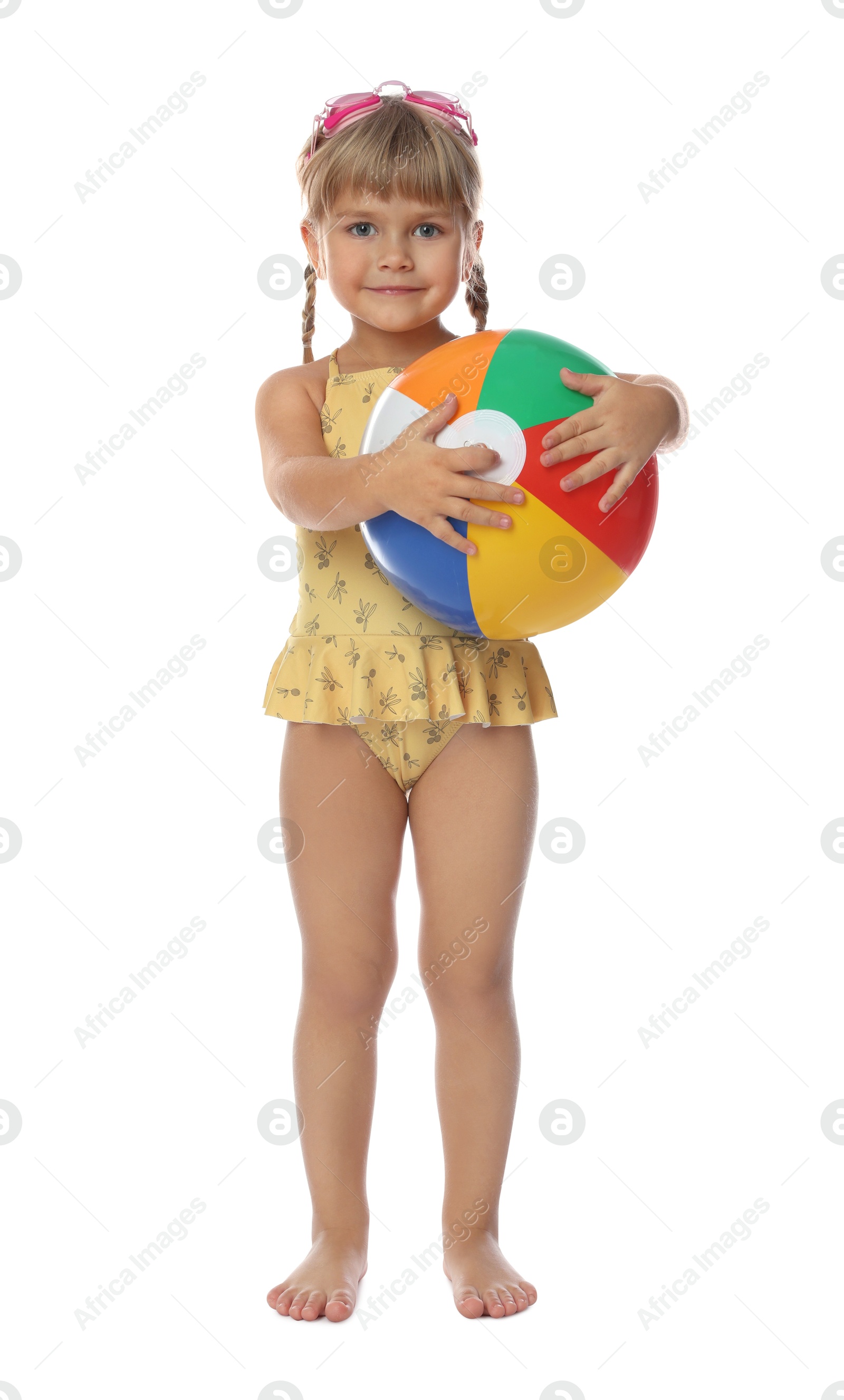 Photo of Cute little girl in swimsuit with inflatable ball and swim goggles on white background