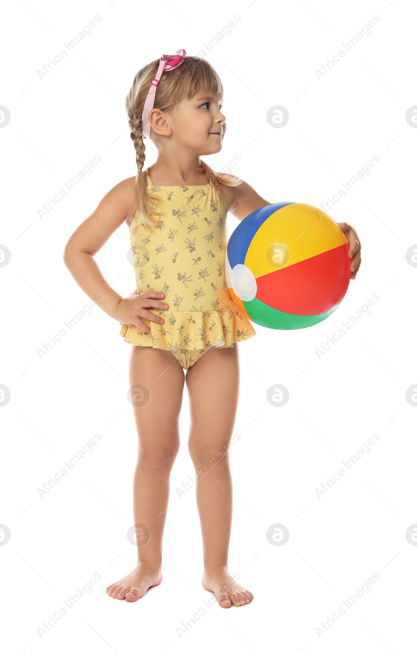 Photo of Cute little girl in swimsuit with inflatable ball and swim goggles on white background