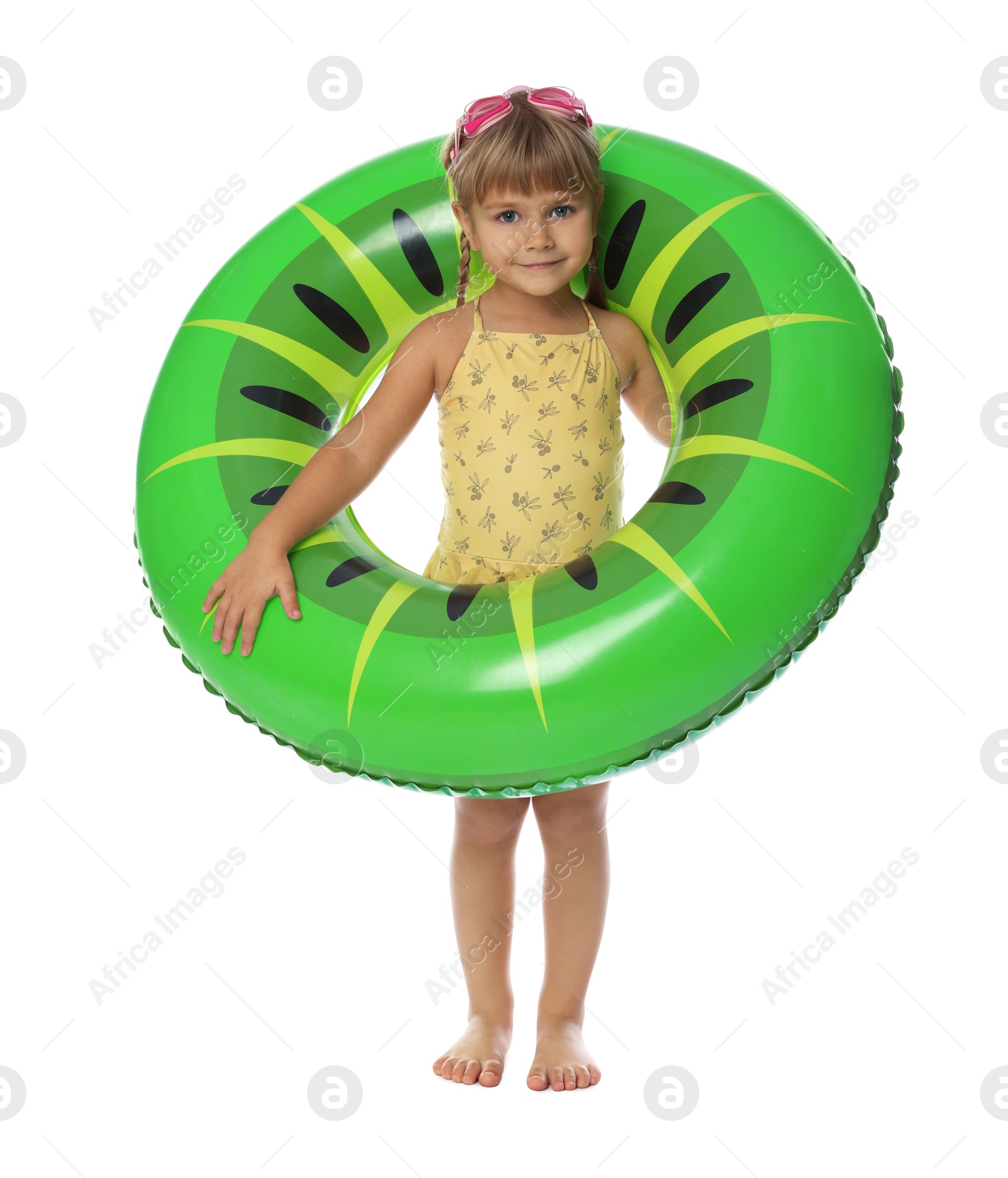 Photo of Cute little girl in swimsuit with inflatable ring and swim goggles on white background