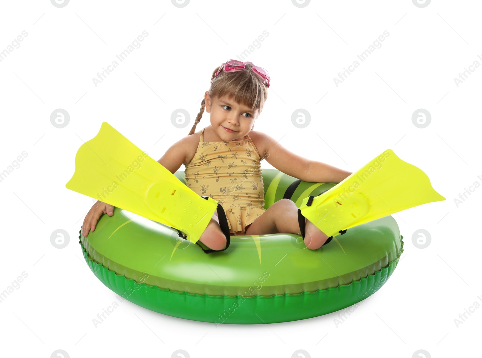 Photo of Cute little girl in swimsuit with inflatable ring, flippers and swim goggles on white background