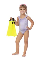 Photo of Cute little girl in swimsuit with flippers and swim goggles on white background