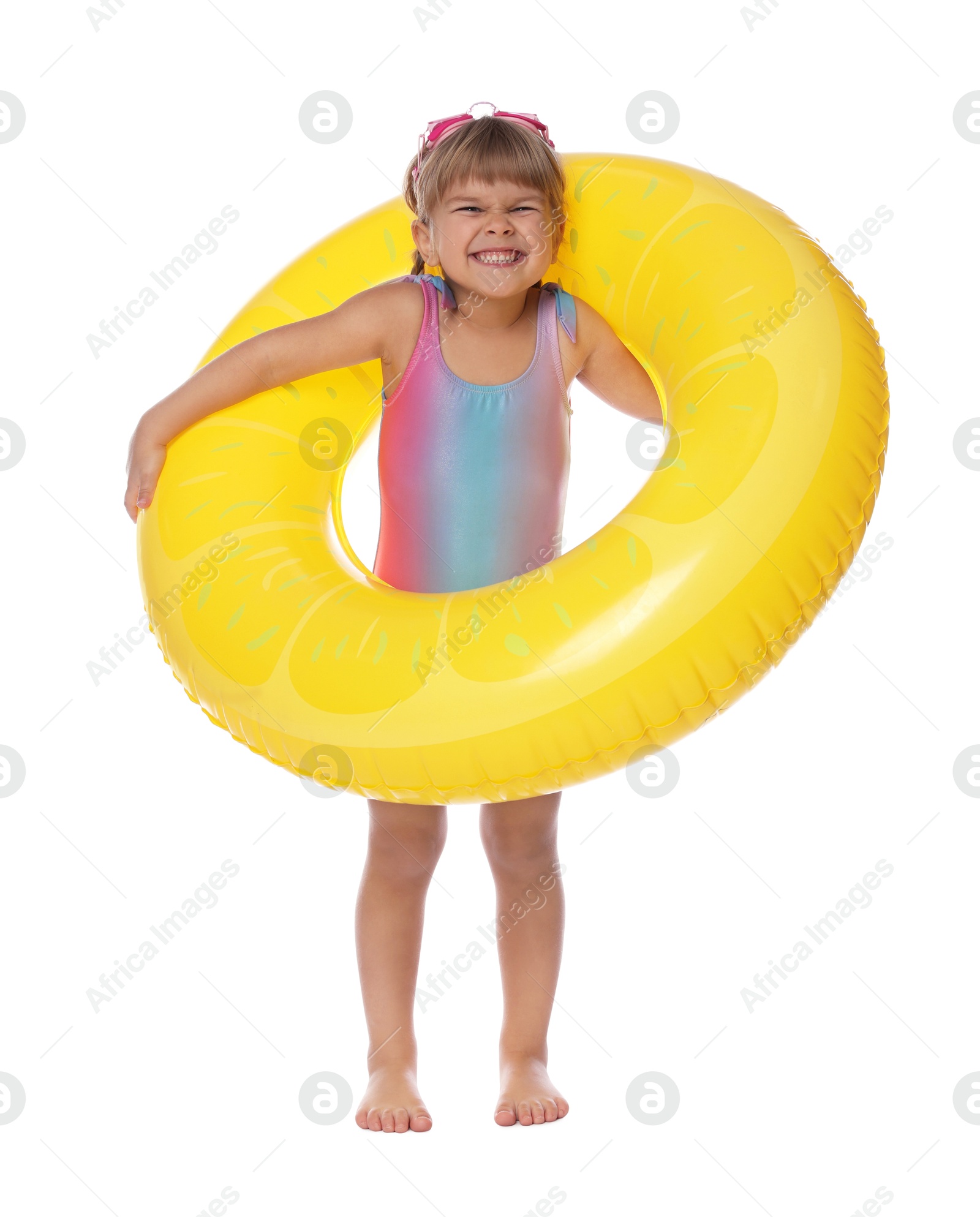 Photo of Cute little girl in swimsuit with inflatable ring on white background